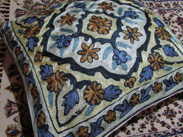 A 16x16 inch (40x40 cm) Kashmiri cushion cover featuring vibrant hand-embroidered vintage Suzani floral patterns.