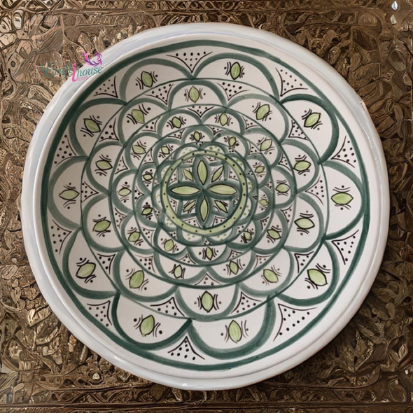 Close-up of the traditional hand-painted geometric and floral designs on a 30cm Moroccan dining plate.