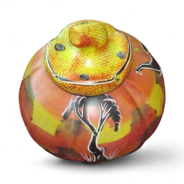 A unique, hand-carved Kenyan soapstone piece that blends organic form with functional kitchen utility.