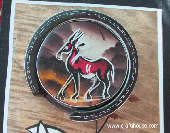 Close-up of the hand-painted elephant and giraffe designs and the etched floral accents on the 10 cm soapstone coasters.
