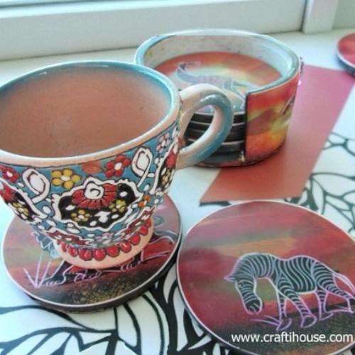 A premium 6-piece hand-painted African soapstone coaster set titled "The Savannah Safari" in its matching hand-carved stone case.