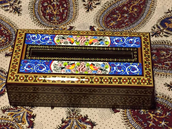 "The Avian Archive" marquetry tissue box shown as a prestigious decorative accessory on a modern luxury coffee table in Dubai.