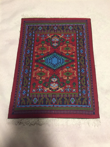 Traditional Middle Eastern style mouse mat sitting on an elegant wooden office desk as a high-impact heritage anchor.