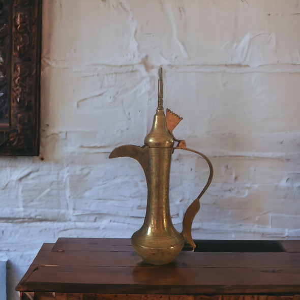 A 45 cm handcrafted solid brass Arabic Dallah coffee pot featuring a traditional curved spout and intricate hand-etched patterns.