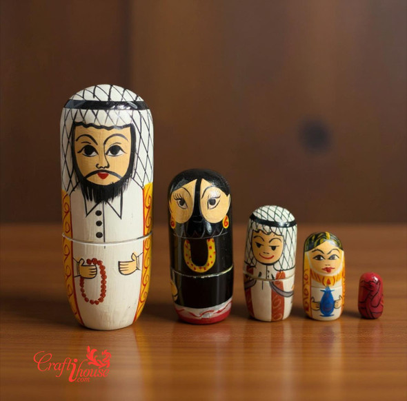 A detailed view of a 5-piece wooden nesting doll set featuring characters in traditional Arabic attire, vibrant and hand-painted.