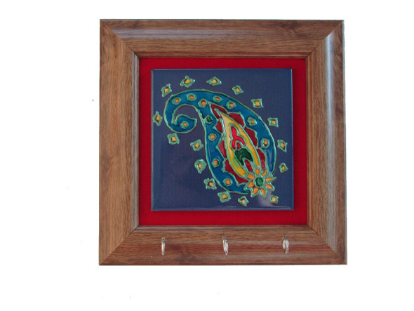 A stunning handcrafted paisley tile with key hooks, showcasing traditional artistic techniques, ideal as a luxury gift.