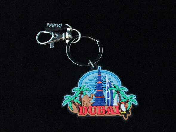 A premium 3D rubber Dubai keychain titled "The Skyline Spark" featuring an embossed city skyline in vibrant colors.