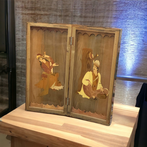 A solid walnut backgammon set displayed on a leather ottoman in a cozy, modern living room.