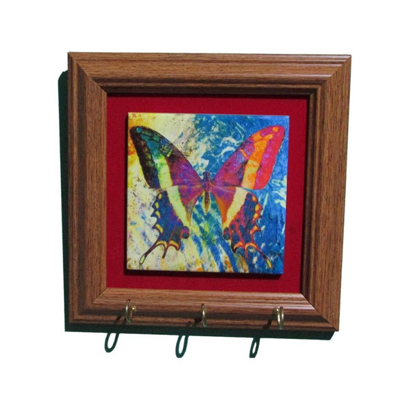 professionally framed 10x10 cm ceramic key holder featuring a vibrant butterfly pattern and three brass hooks for wall organization.