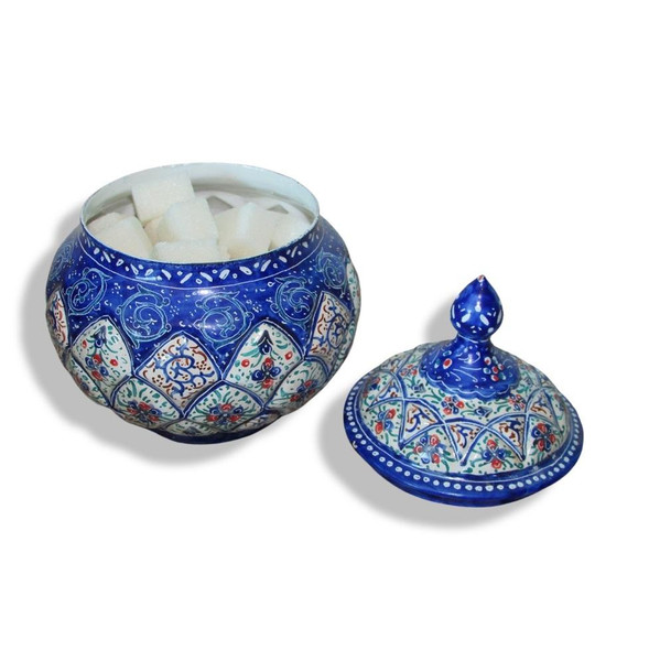 A vibrant blue hand-painted Minakari sugar bowl with a domed lid and intricate white floral patterns
