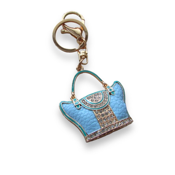 A stylish and glamorous handbag-motif keychain that blends functional utility with a chic, luxury-inspired design.