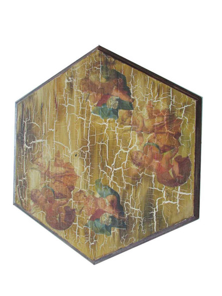 A minimalist hexagonal wooden bedside table styled next to a bed with a modern lamp and books.