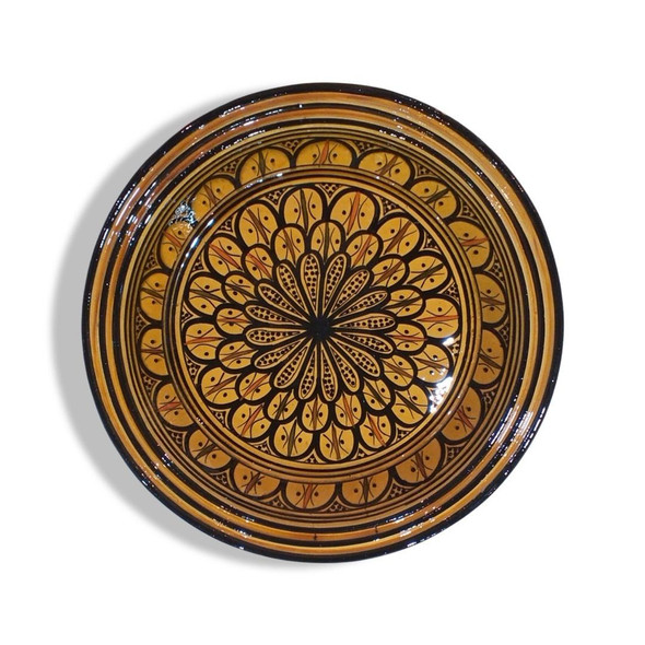 A large Moroccan ceramic plate featuring traditional Safi hand-painted geometric patterns in cobalt blue