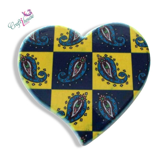 A charming heart-shaped ceramic fridge magnet featuring a detailed blue and yellow traditional paisley pattern print.