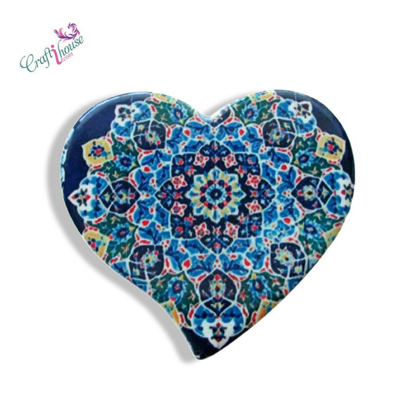 A heart-shaped printed ceramic fridge magnet featuring an intricate traditional mandala tile pattern in rich blue, turquoise, red, and yellow.