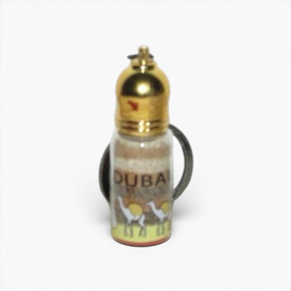 A miniature 5 cm glass sand bottle keychain featuring hand-layered desert sand art and a polished gold-toned cap.