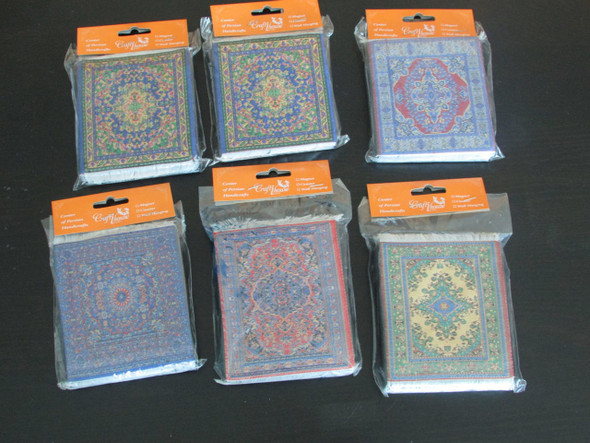 A curated set of four round handmade carpet tea coasters with different colorful Persian-style patterns.