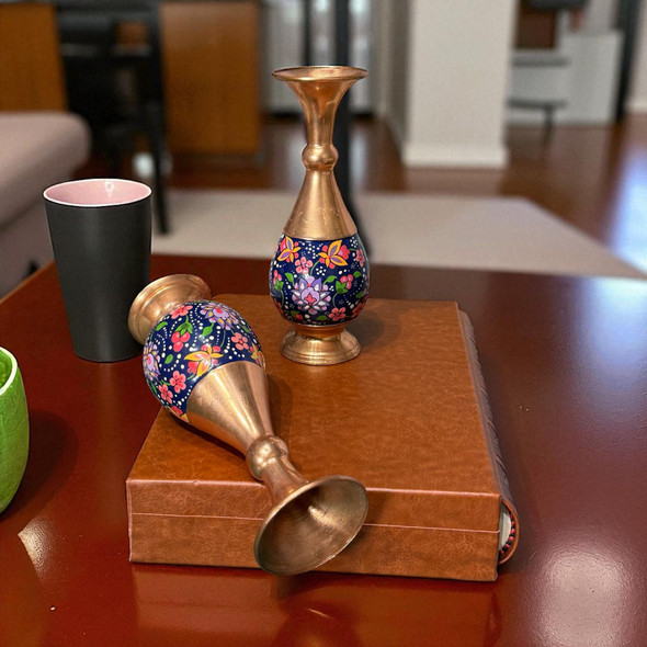A premium 16 cm hand-painted Mes Pardaz copper flower vase featuring vibrant assorted floral patterns and a polished copper base.
