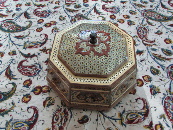 A high-resolution detail shot of the star-shaped mosaic patterns made from wood, bone, and brass wires on the candy box
