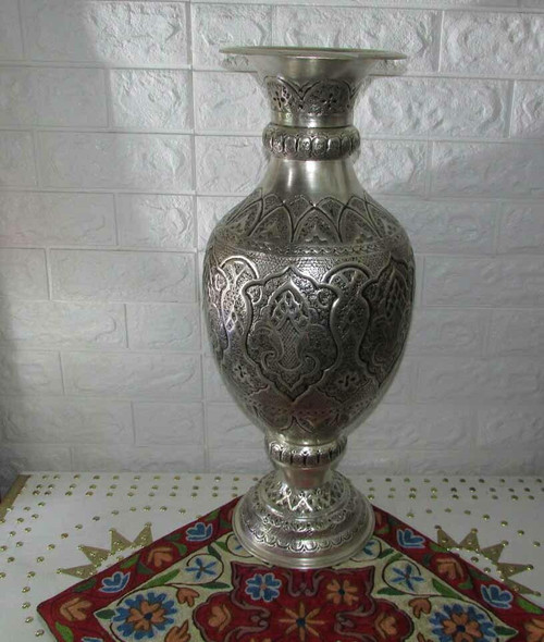 A stunning 55 cm tall hand-engraved copper vase featuring intricate traditional patterns