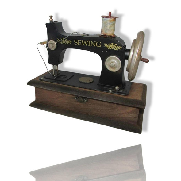 A handcrafted metal model of a vintage sewing machine with a black body and silver accents on a wooden base.