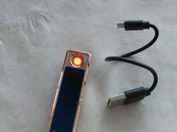 Close-up view of the printed camel graphic and Dubai text detail on modern rechargeable electronic lighters.