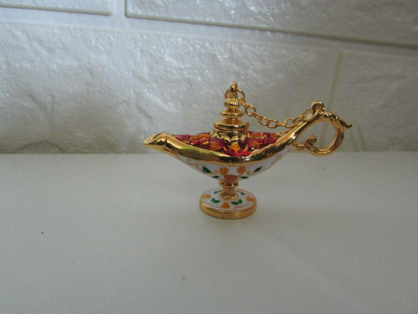 A set of ornate 6x4 cm miniature Aladdin's lamps, a must-have souvenir for tourists visiting Dubai. Shop unique artisan gifts at Craftihouse.