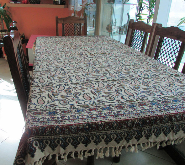 A rectangular Ghalamkar cotton tablecloth featuring hand-blocked Persian paisley and floral patterns