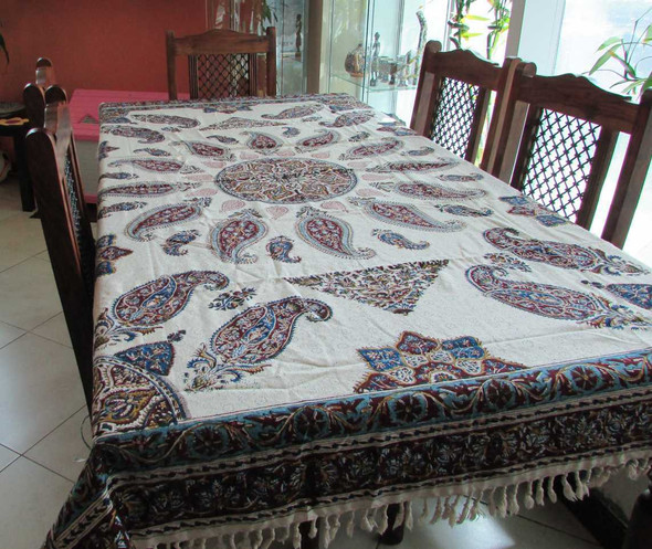 A 200x135 cm rectangular Ghalamkar tablecloth spread across a large dining table, featuring traditional navy and madder red floral patterns.