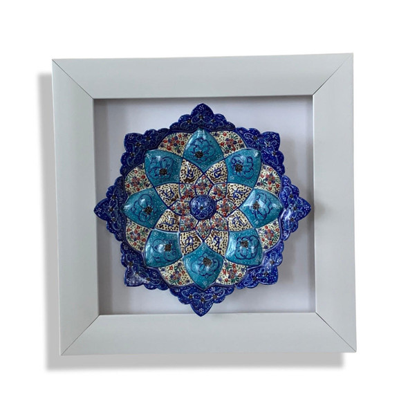 A premium 23x23 cm framed 16 cm hand-painted Meenakari copper plate titled "The Luminous Star" featuring vibrant blue and white radial enamel patterns.