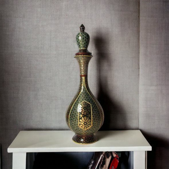 The Khatamkari copper pitcher styled on a dark wood bar top next to crystal glasses, highlighting its use as a luxury wine server.