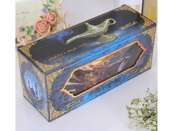 Close-up of the brilliant gold finish and the raised traditional patterns on the Dubai souvenir genie lamp.