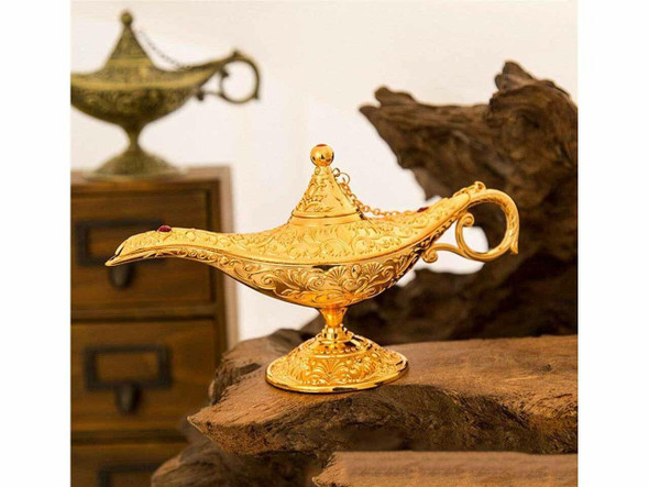 A 12x8 cm decorative golden-colored magic Aladdin lamp from Dubai with intricate embossed floral details.