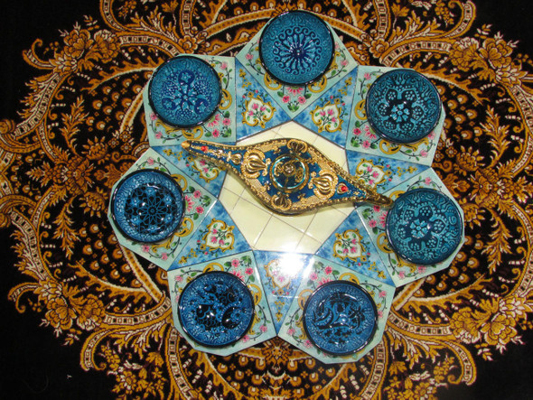 An ornate 7-piece ceramic bowl set with a central decorative lamp, making for a thoughtful, culturally inspired gift for decor enthusiasts.
