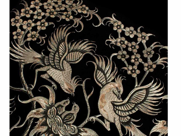 Close-up of Qalamzani copper engraving showing birds and floral pattern, highlighting the fine chiselwork and striking black-oxidized contrast.