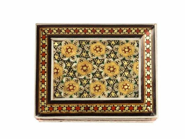 A professional room setting presentation shot of the small Khatamkari wooden gift box showcasing its stunning geometric inlay and rich cultural charm.