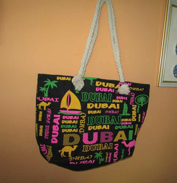 Detailed view of the sturdy rope handles and vibrant Dubai-themed graphics on this canvas tote