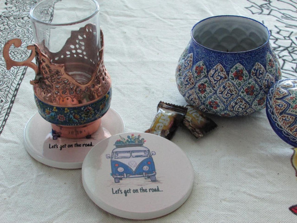 A sophisticated ceramic coaster that blends modern printing techniques with a playful, road-trip-inspired aesthetic.