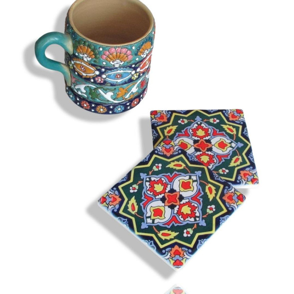 A premium 9 cm green floral handmade tile coaster featuring a vibrant traditional pattern and high-gloss ceramic finish.