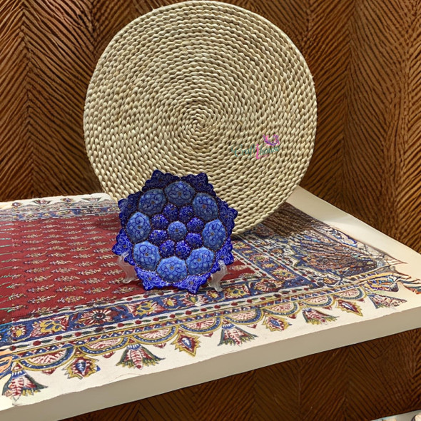 A premium 16 cm handmade Minakari copper plate featuring vibrant hand-painted blue enamel patterns and a scratch-proof high-gloss finish.