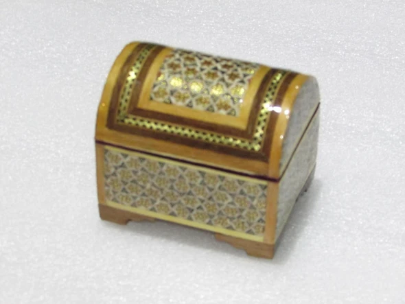 An elegantly crafted 8x6 cm wooden jewelry box with a unique dome silhouette and fine inlay borders.