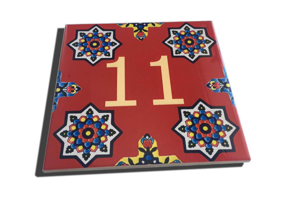 A professional product presentation of the custom ceramic house number tile from a premier UAE art, gift, and home decor supplier.