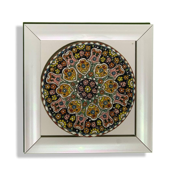 A stunning 15 cm hand-painted embossed ceramic plate with intricate assorted patterns