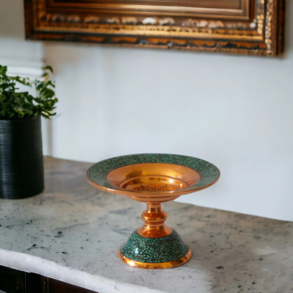 A premium 16 cm turquoise inlaid copper pedestal bowl featuring a hand-hammered finish and brilliant hand-set turquoise stones.