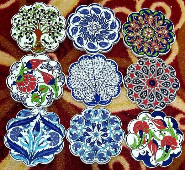 A sophisticated, handmade ceramic coaster that blends traditional decorative tile aesthetics with practical daily use.