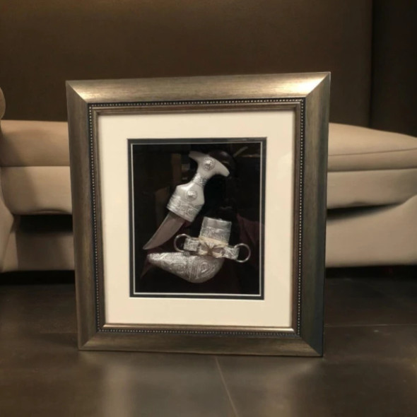 A professional product presentation of the exclusive handmade framed UAE Khanjar dagger from a premier UAE shop.