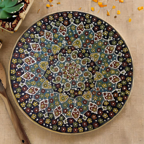 A monumental 40 cm handmade clay plate featuring vibrant embossed patterns and a high-gloss protective glaze for wall decor.