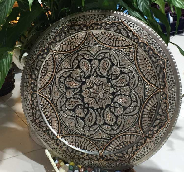 A professional product presentation of the exclusive handmade 40 cm engraved copper tray from a premier UAE shop.