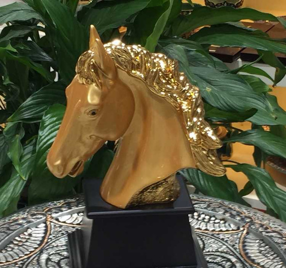 Golden horse head with stand