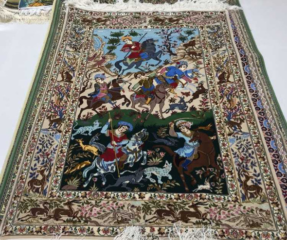 A grand 180x120 cm handmade wool and silk carpet featuring intricate pictorial battle scenes, rich narrative details, and traditional fringed edges.